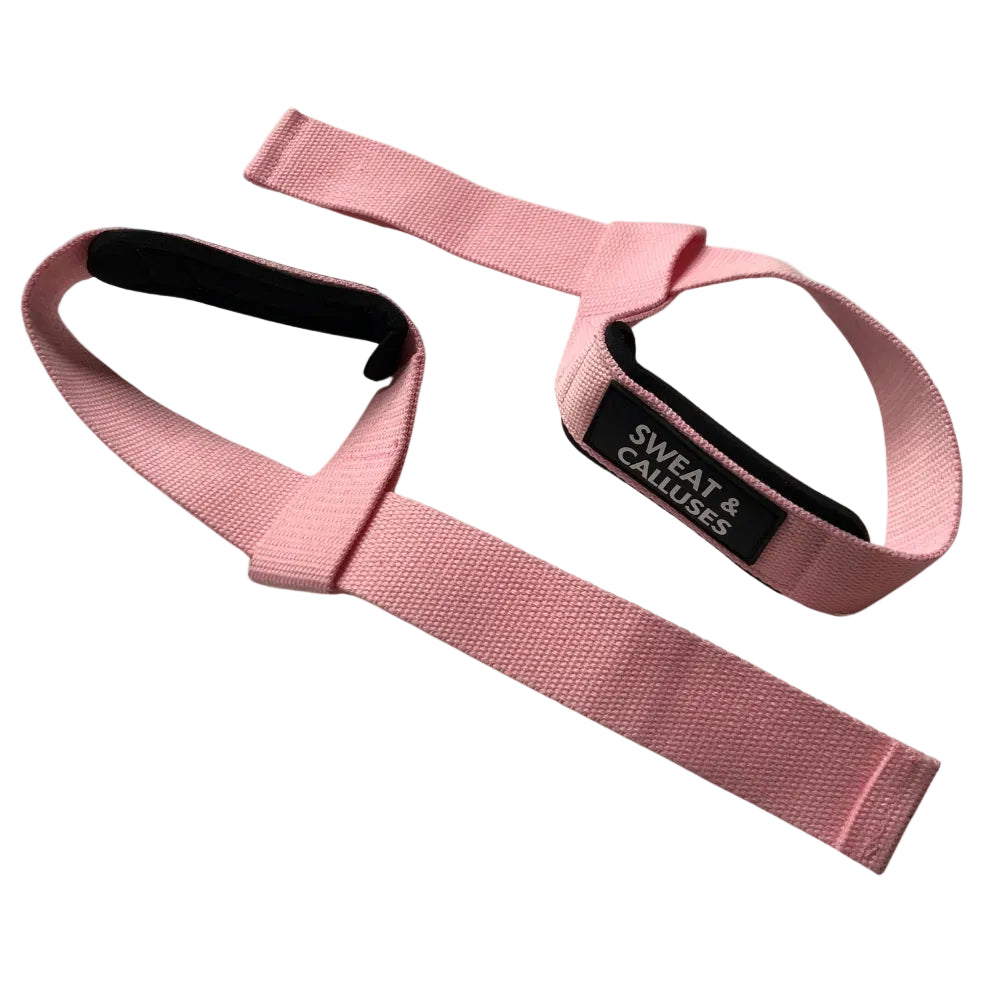 A pink wrist strap typically used for weightlifting or powerlifting, with black neoprene padding.